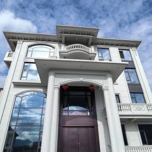 青岛白麻别墅外墙干挂石材效果示例