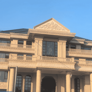 青岛黄金麻别墅外墙干挂石材效果示例